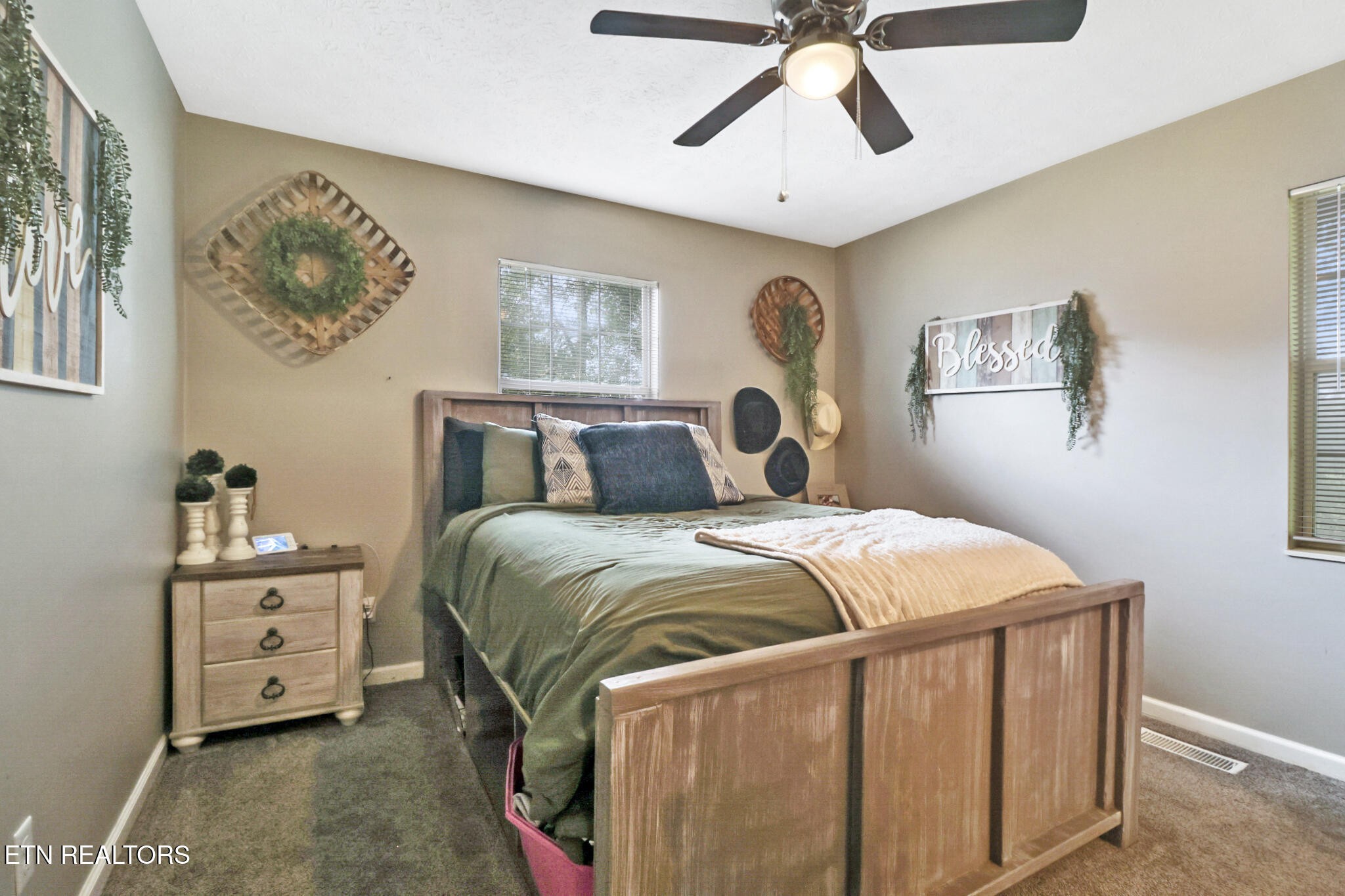 604 Bear Cub Lane Clinton, TN 37716 - Photo 11 of 23 a bedroom with a bed and painting on the wall