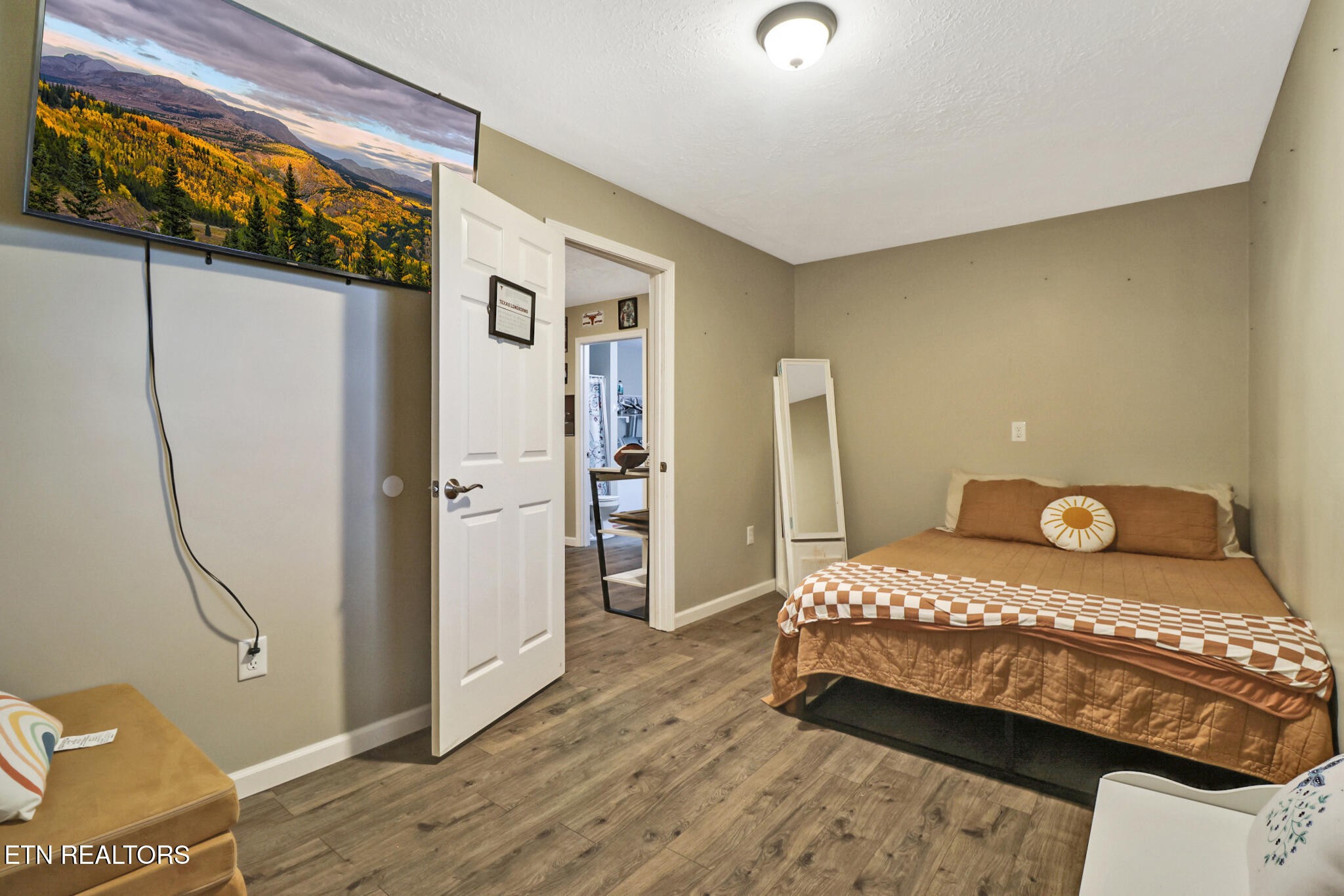 604 Bear Cub Lane Clinton, TN 37716 - Photo 20 of 23 a bedroom with a bed and wooden floor