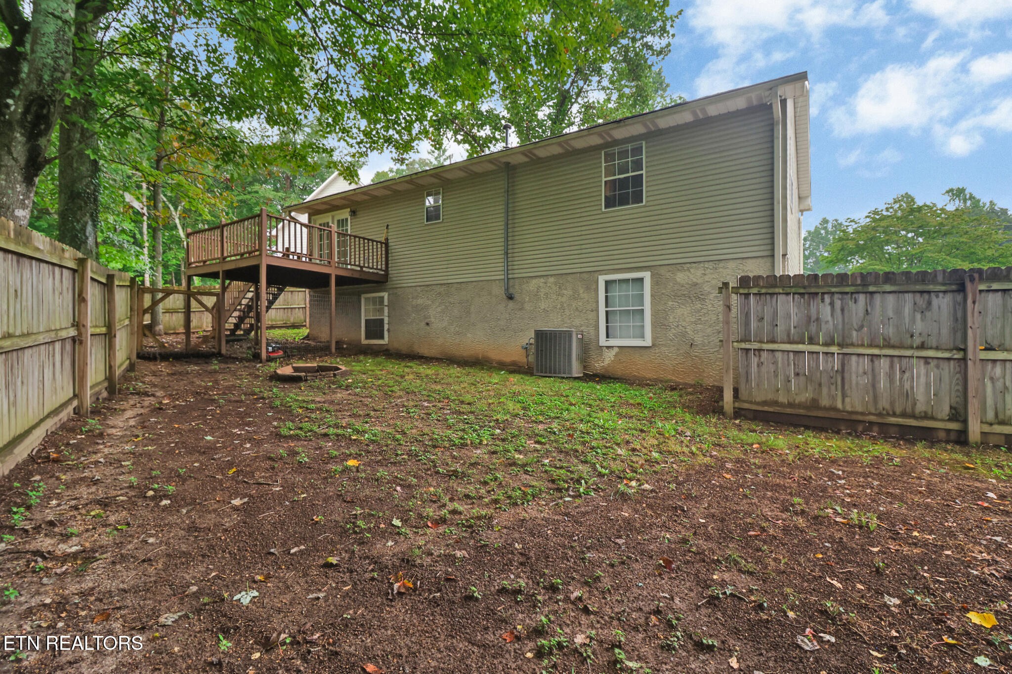 604 Bear Cub Lane Clinton, TN 37716 - Photo 22 of 23 a view of backyard with small cabin and wooden fence