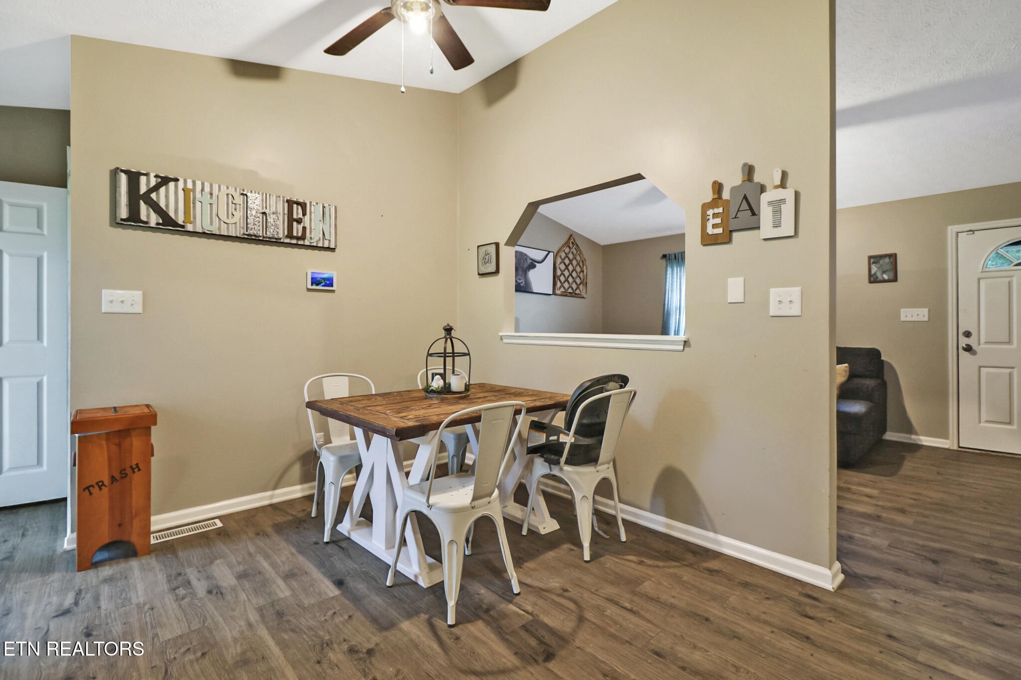 604 Bear Cub Lane Clinton, TN 37716 - Photo 9 of 23 a view of a dining room with furniture and wooden floor