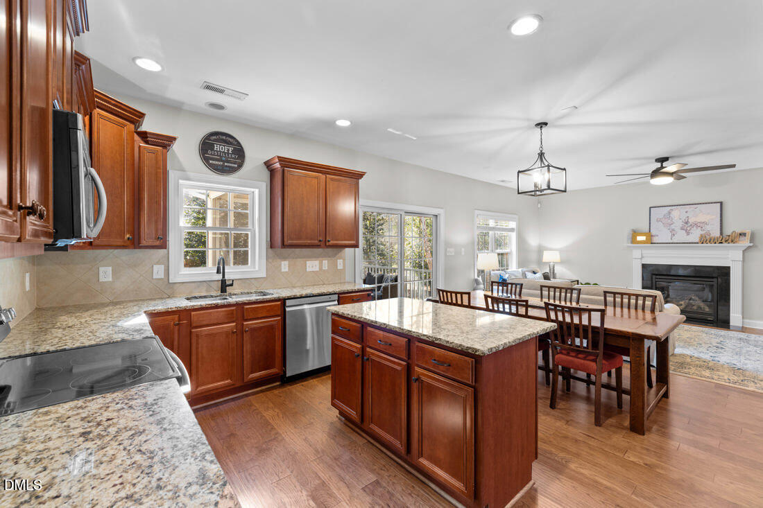 170 Valley Pines Circle Spring Lake, NC 28390 - Photo 13 of 55 a large kitchen with cabinets table and chairs