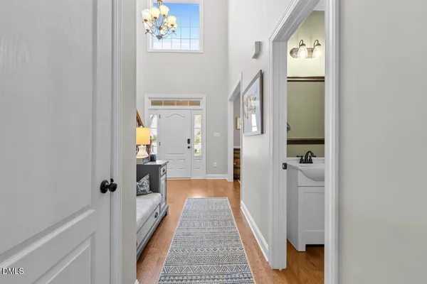 a large kitchen with cabinets table and chairs