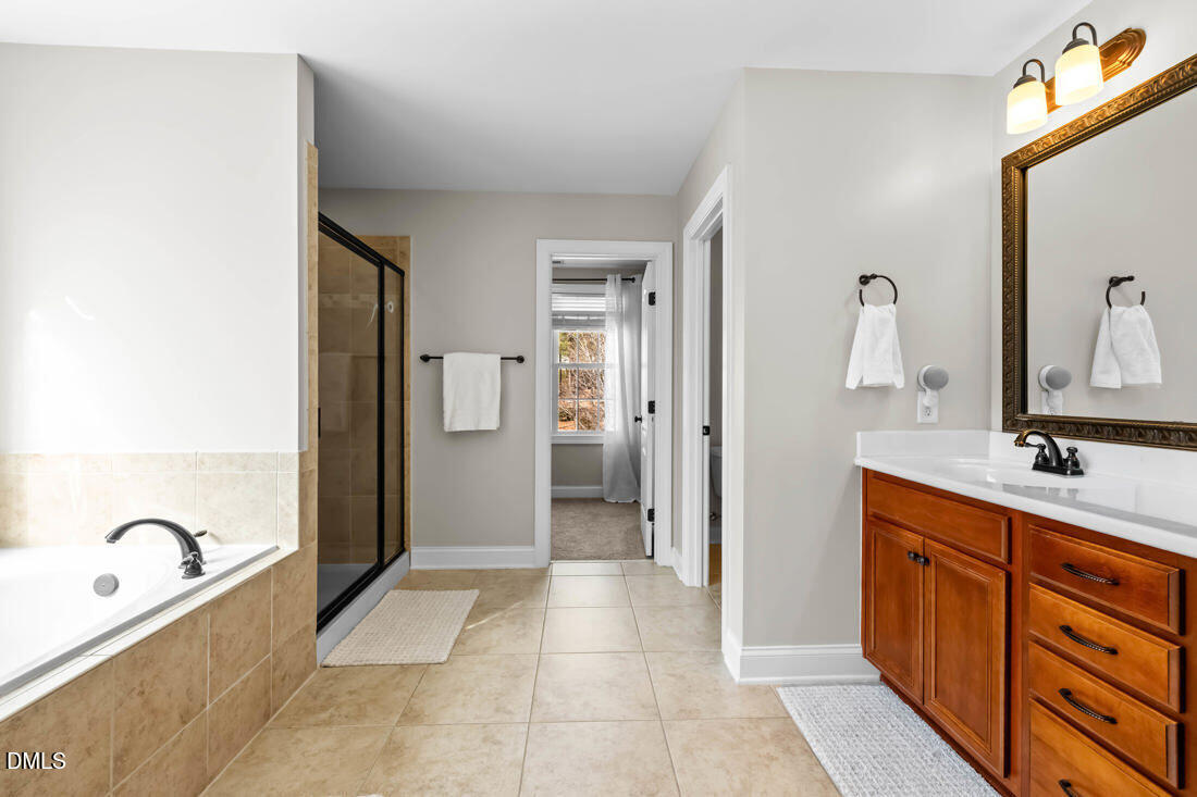 170 Valley Pines Circle Spring Lake, NC 28390 - Photo 28 of 55 a bathroom with a sink a toilet and shower