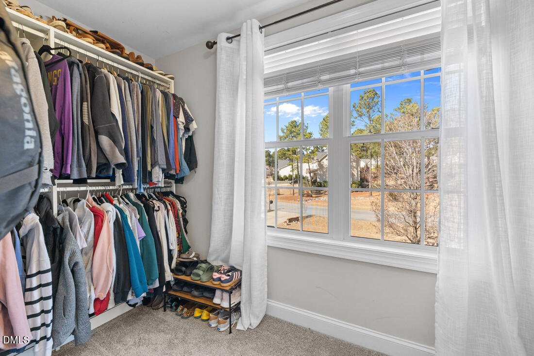 170 Valley Pines Circle Spring Lake, NC 28390 - Photo 29 of 55 a view of walk in closet with clothes and shoes