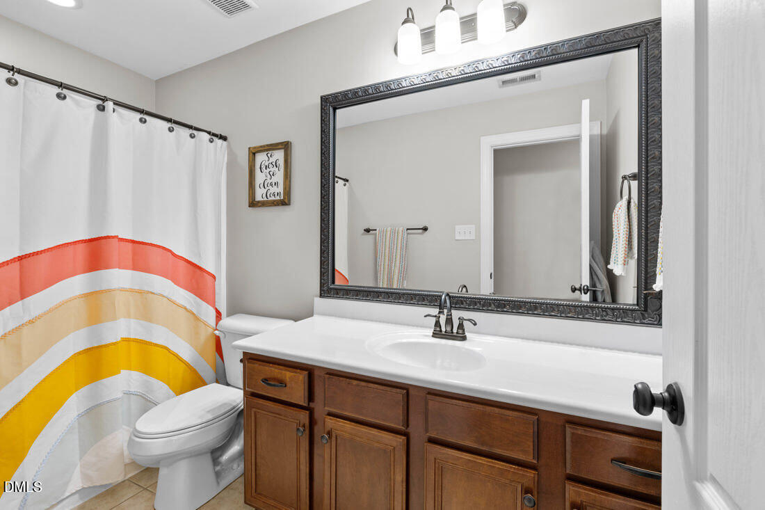 170 Valley Pines Circle Spring Lake, NC 28390 - Photo 34 of 55 a bathroom with a sink and a mirror