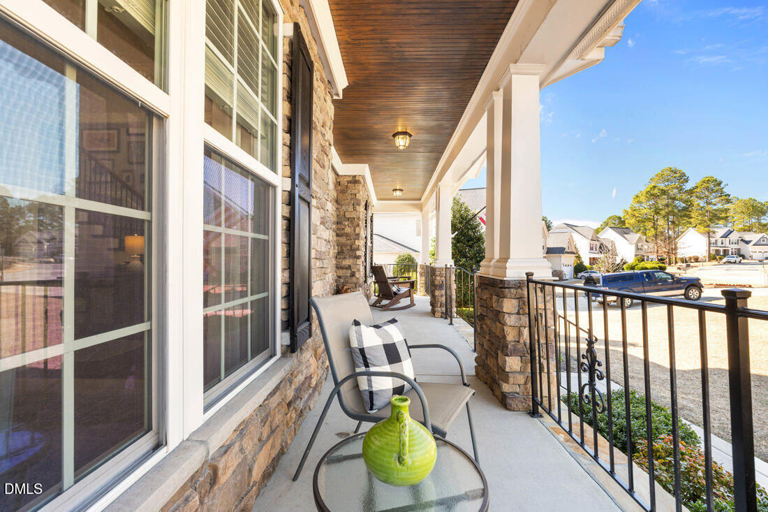 170 Valley Pines Circle Spring Lake, NC 28390 - Photo 44 of 55 a view of a balcony with dining area and wooden floor