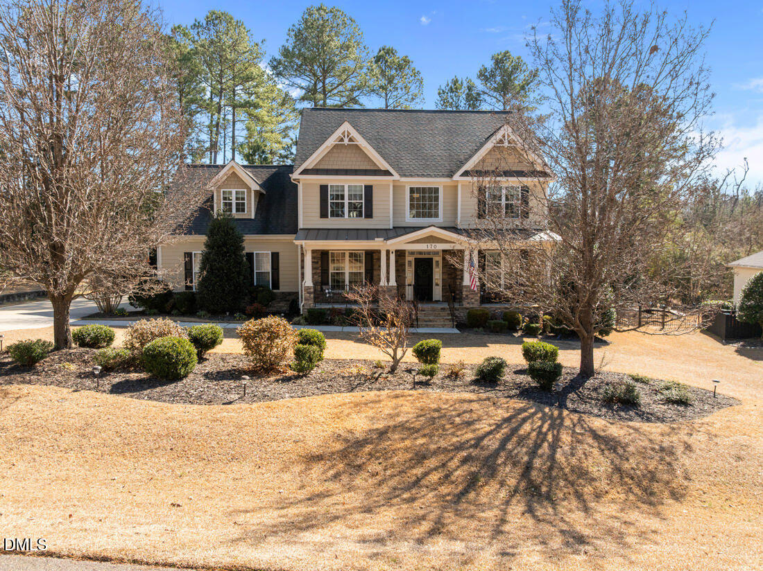 170 Valley Pines Circle Spring Lake, NC 28390 - Photo 49 of 55 a view of a white house with a yard covered in snow