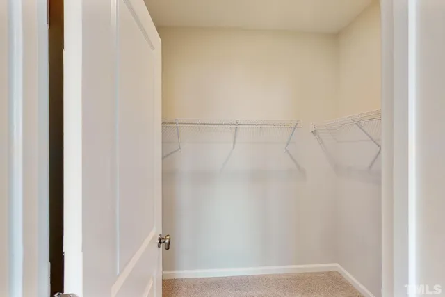 a kitchen with granite countertop a sink window and stainless steel appliances