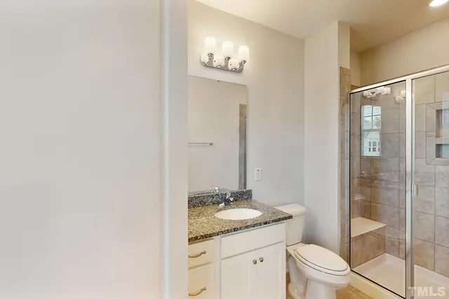 an empty room with closet and bathroom