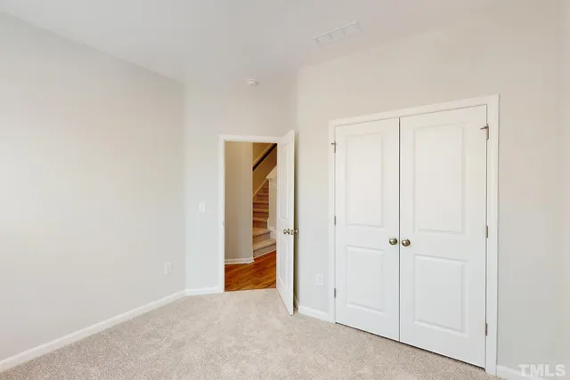 a kitchen with kitchen island a sink and a wooden floor