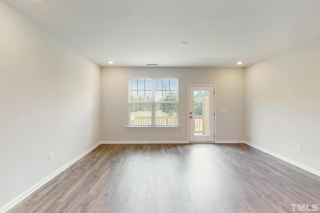 a view of kitchen dining table chairs microwave and cabinets