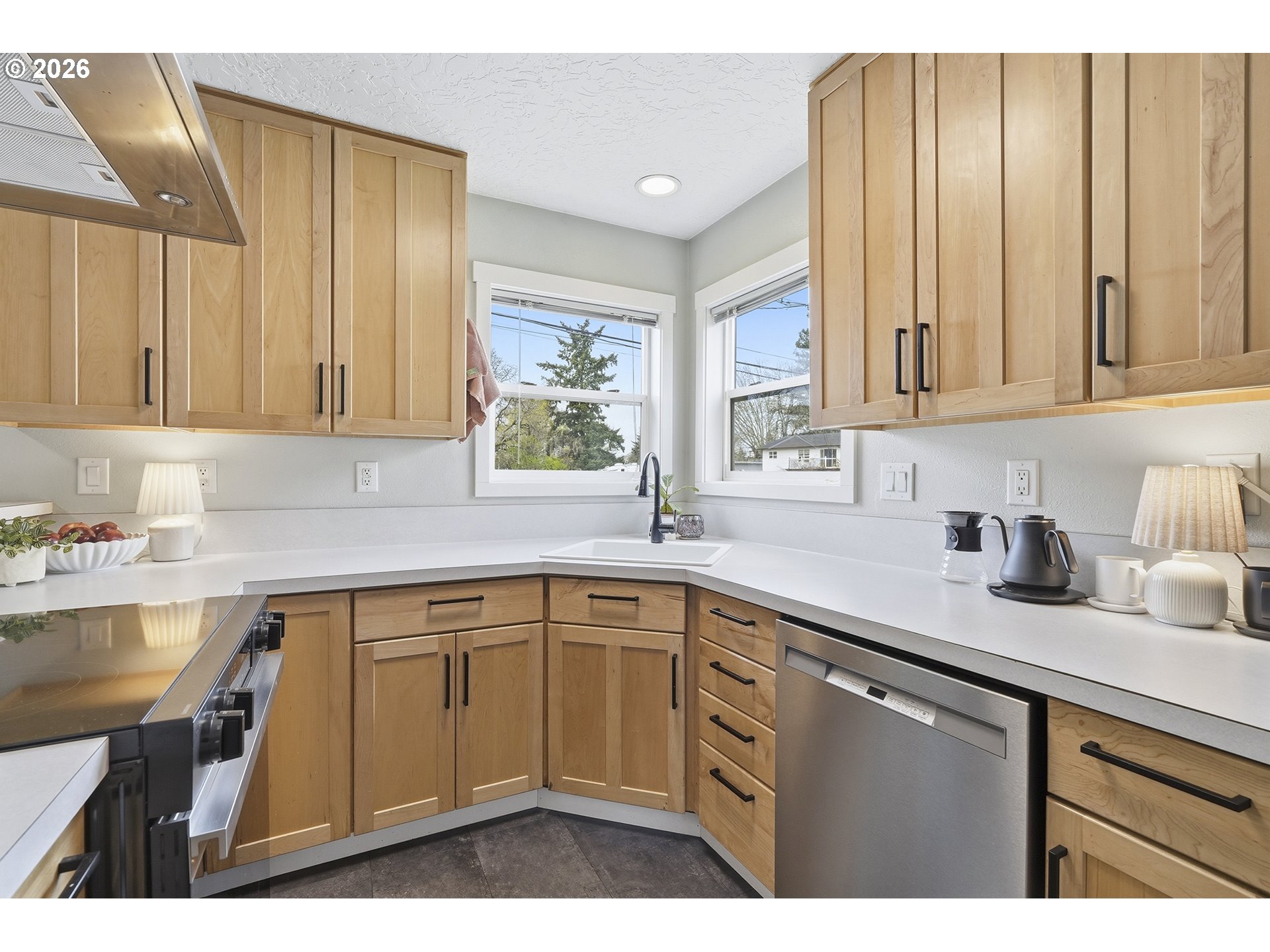 11250 Southwest 78th Avenue Tigard, OR 97223 - Photo 13 of 30 a kitchen with a sink cabinets and window
