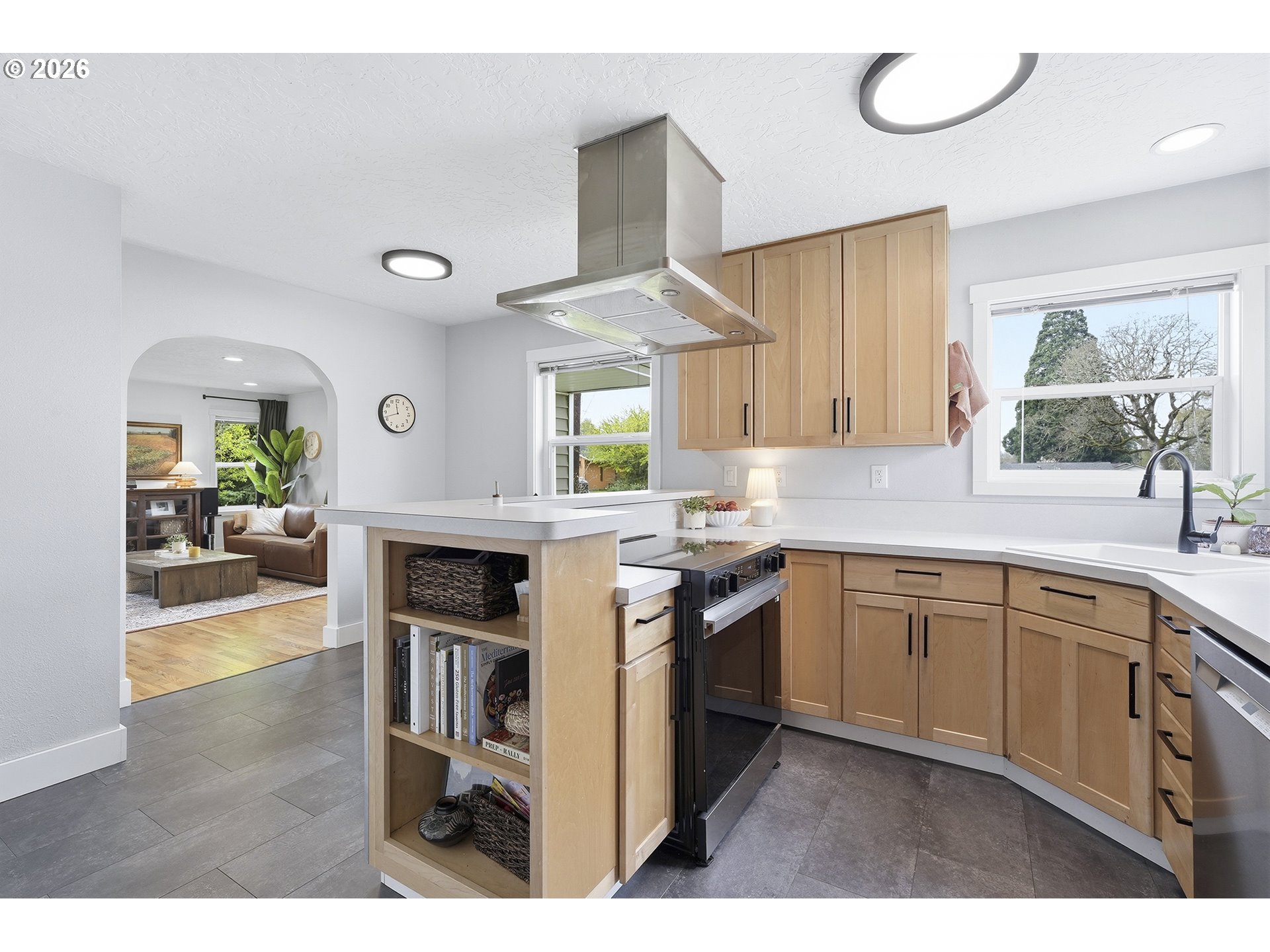 11250 Southwest 78th Avenue Tigard, OR 97223 - Photo 15 of 30 a kitchen with stainless steel appliances granite countertop a stove a sink and a refrigerator