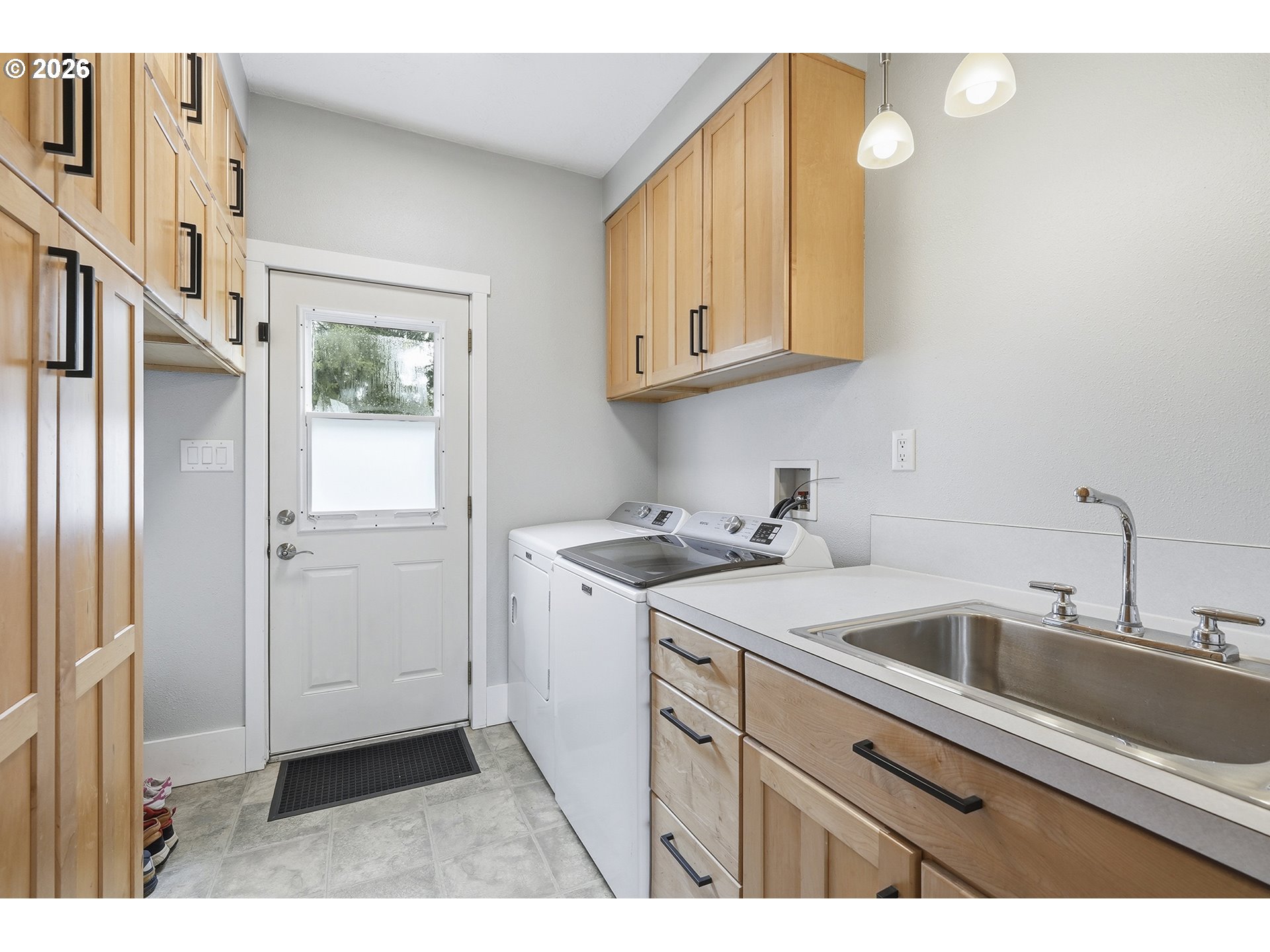 11250 Southwest 78th Avenue Tigard, OR 97223 - Photo 23 of 30 a kitchen with a sink and cabinets
