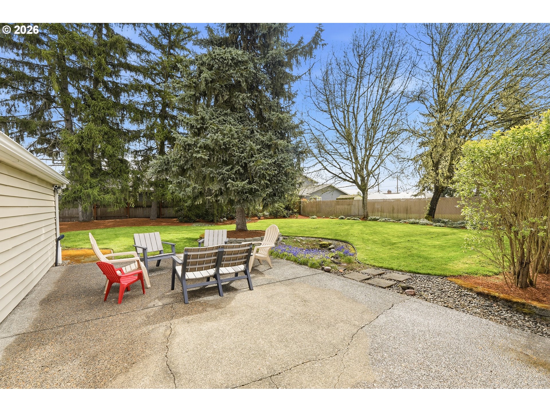 11250 Southwest 78th Avenue Tigard, OR 97223 - Photo 24 of 30 a backyard of a house with table and chairs