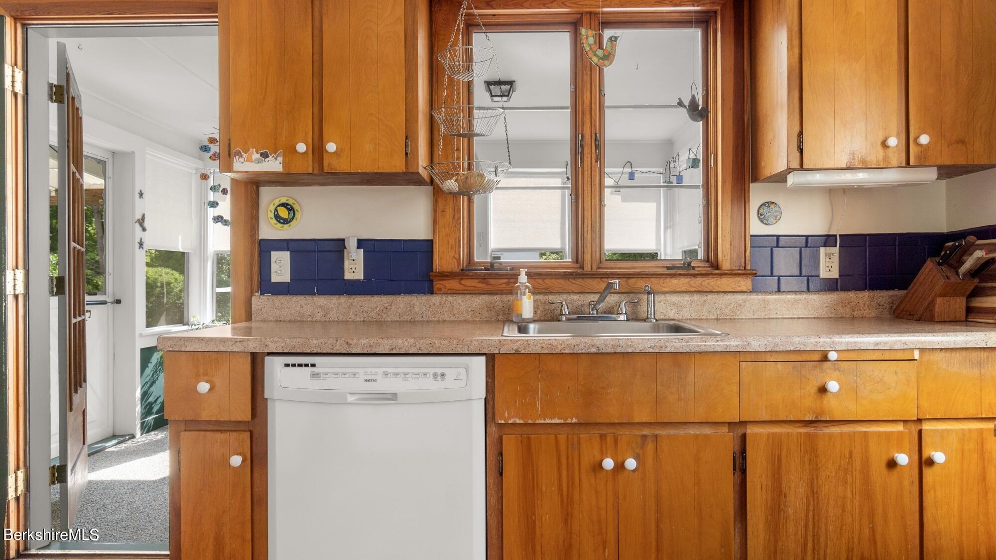 23 Ridgeway Avenue Pittsfield, MA 01201 - Photo 16 of 29 a kitchen with stainless steel appliances granite countertop a refrigerator a sink and a stove