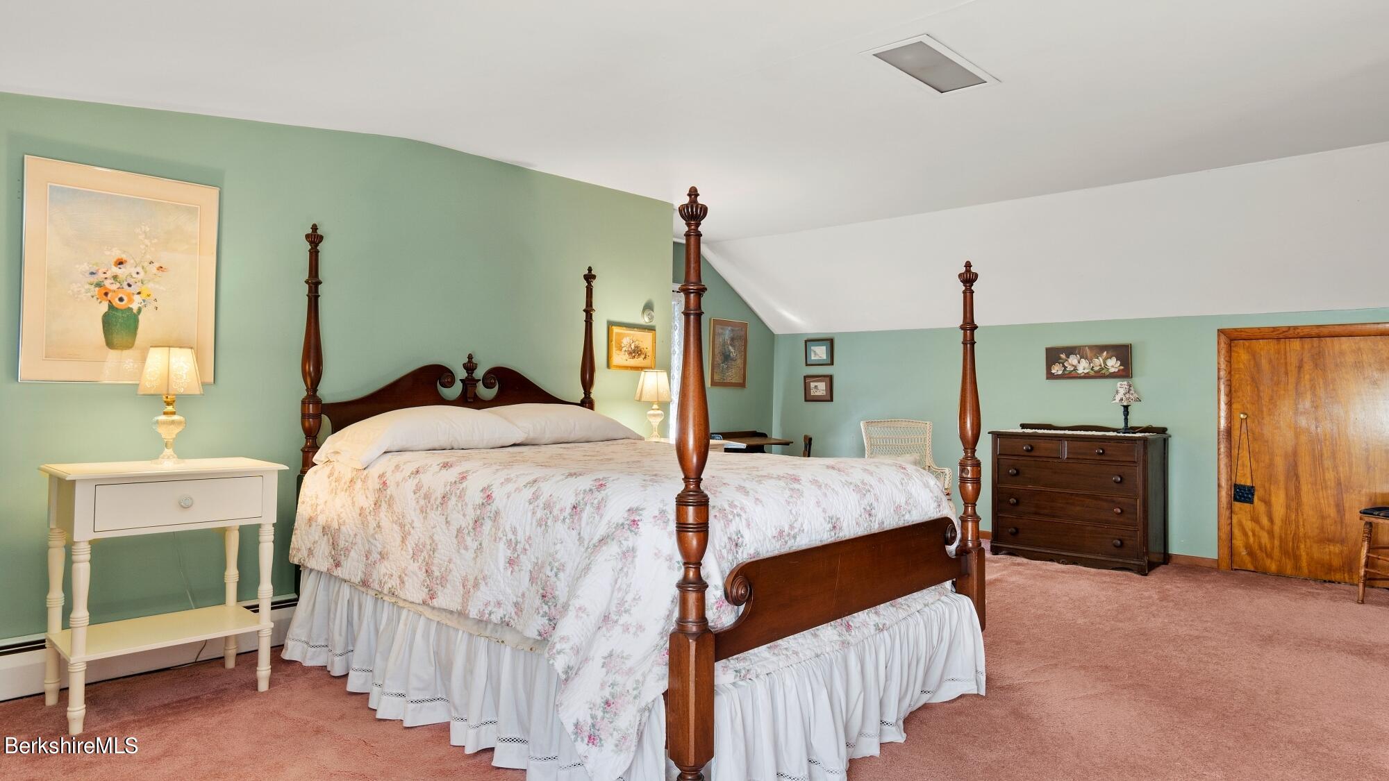 23 Ridgeway Avenue Pittsfield, MA 01201 - Photo 25 of 29 a bedroom with a bed and a chandelier