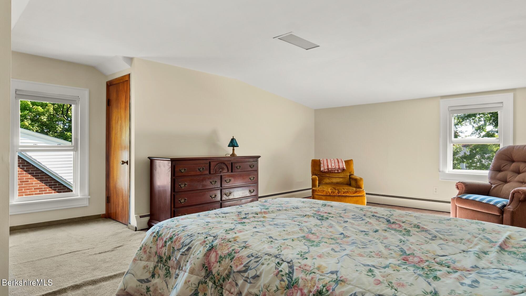 23 Ridgeway Avenue Pittsfield, MA 01201 - Photo 26 of 29 a bedroom with a bed and wooden floor