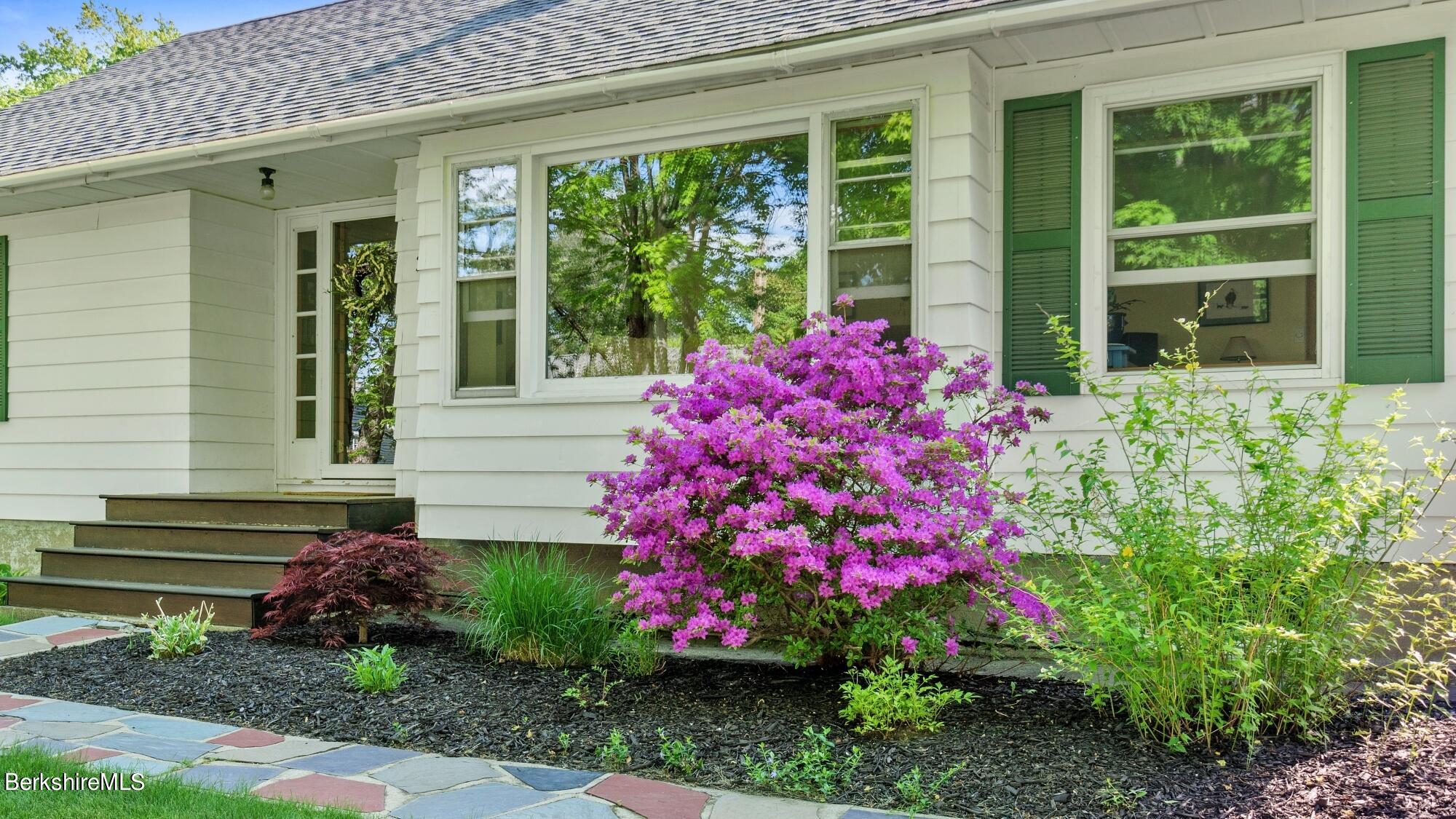 23 Ridgeway Avenue Pittsfield, MA 01201 - Photo 3 of 29 a pink flowers in front of the house