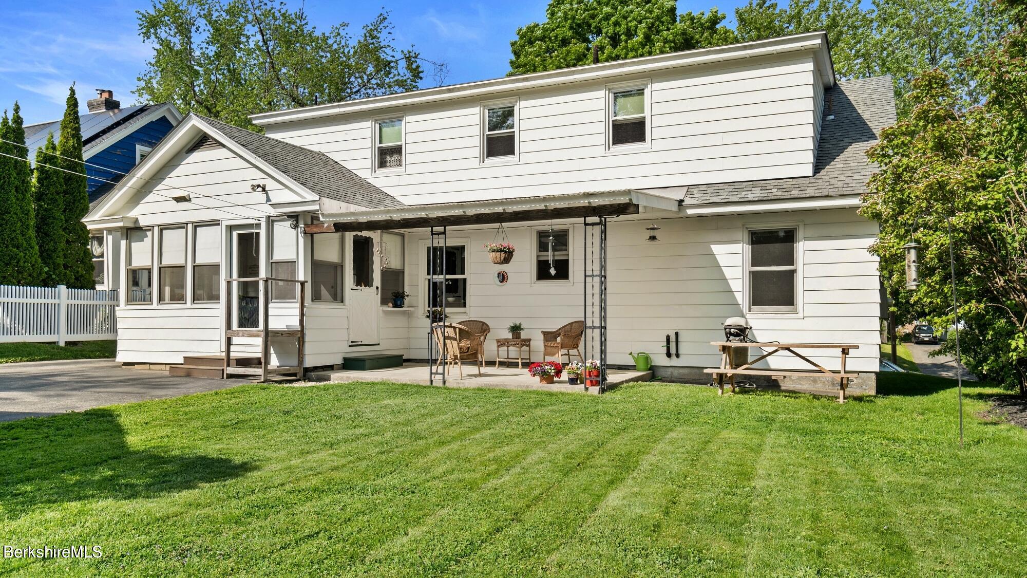 23 Ridgeway Avenue Pittsfield, MA 01201 - Photo 6 of 29 a front view of a house with a yard and sitting area