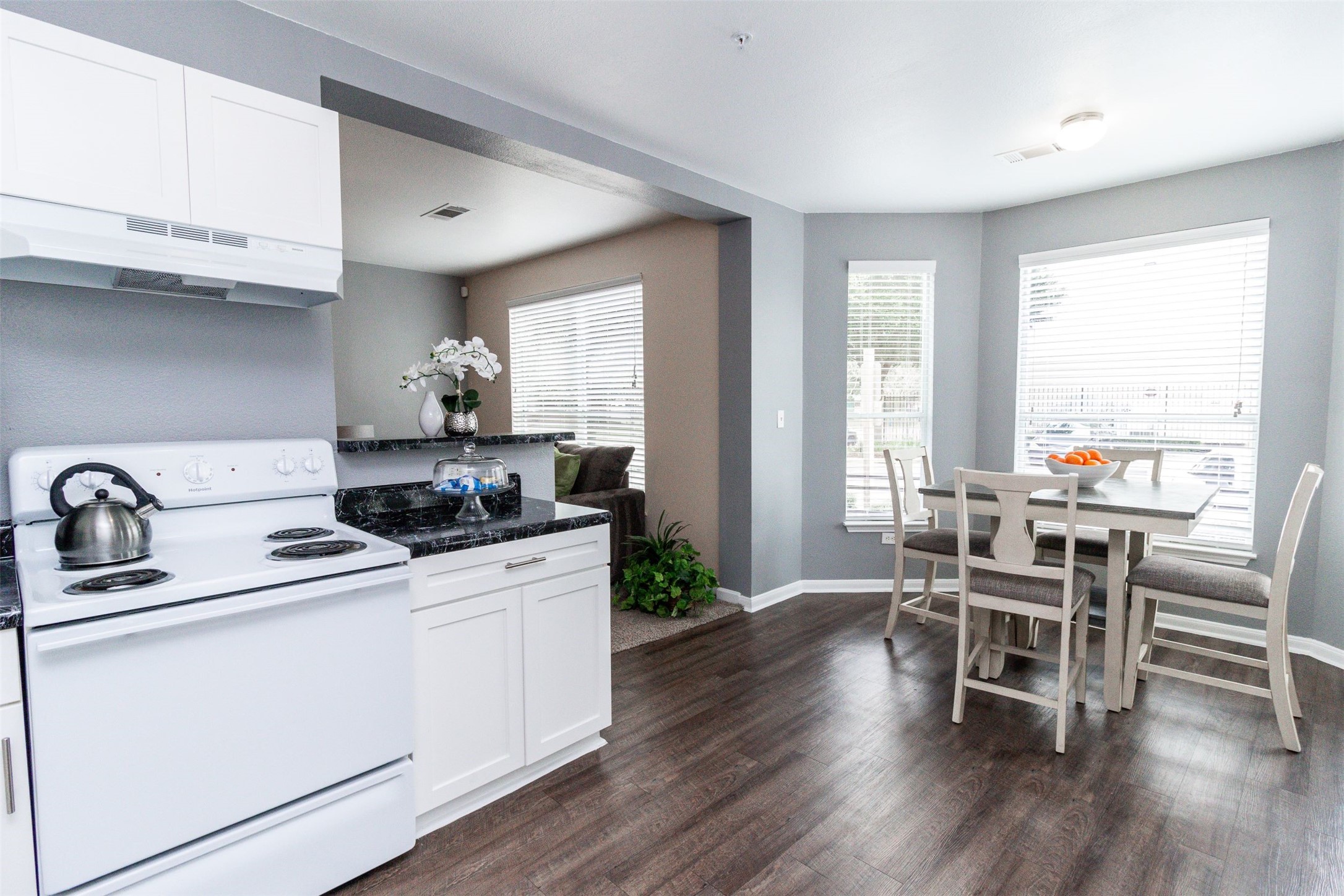 3560 Dixie Drive Houston, TX 77021 - Photo 2 of 11 a kitchen with stainless steel appliances white cabinets and wooden floor