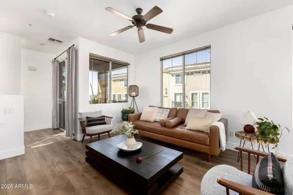 a living room with furniture and a large window