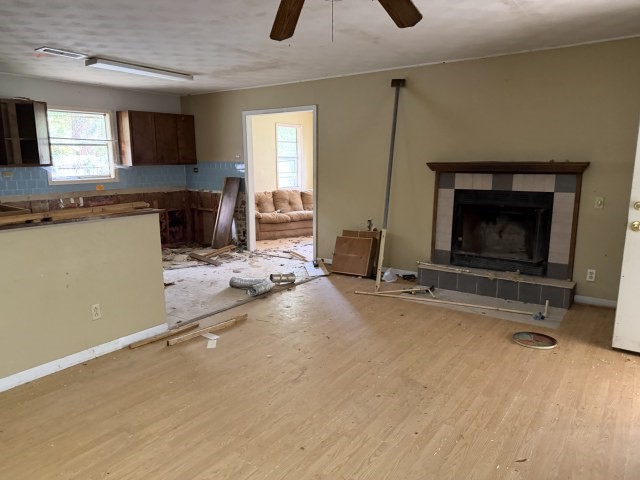 579 Popher Creek Road Zavalla, TX 75980 - Photo 6 of 10 a kitchen with furniture and a fireplace