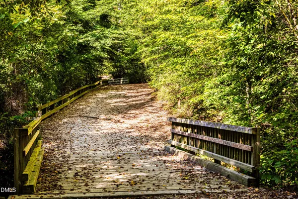 a view of a water fountain and sitting area