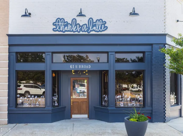 a view of a house with a potted plant