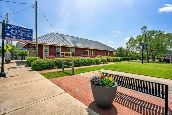 a view of a garden with sitting area