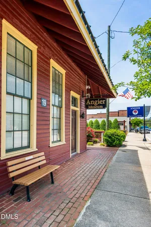 a view of a chair and table in the garden