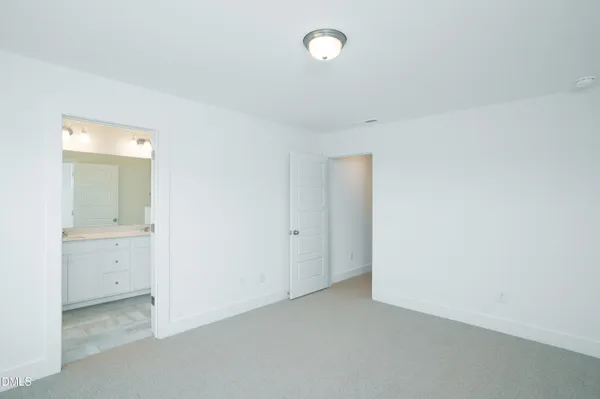 an empty room with a bathroom