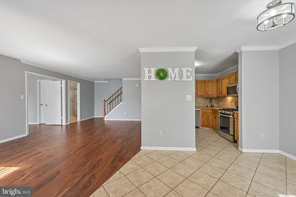 a view of a kitchen cabinets and wooden floor