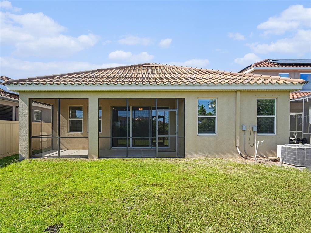 4429 Conchfish Lane Osprey, FL 34229 - Photo 18 of 20 a front view of a house with a garden and porch