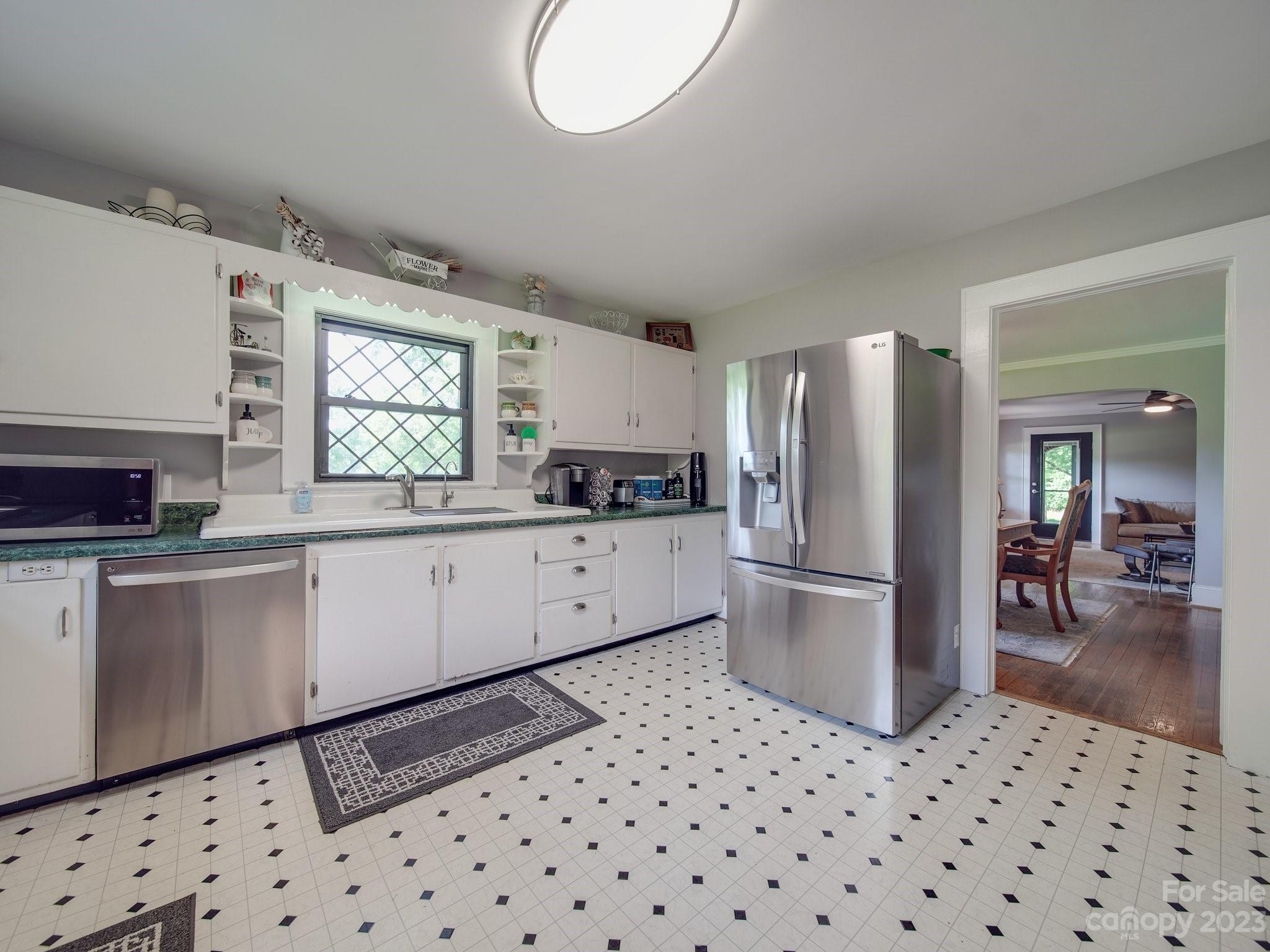4901 Highway 24 Midland, NC 28107 - Photo 11 of 31 a kitchen with a refrigerator a stove top oven a sink and dishwasher