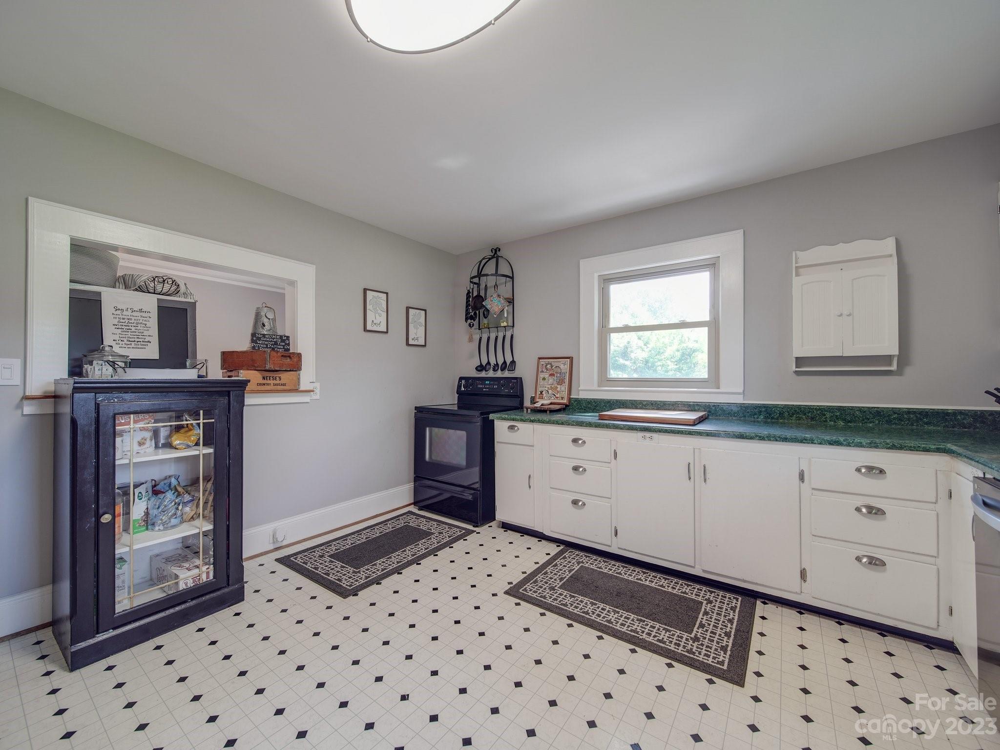 4901 Highway 24 Midland, NC 28107 - Photo 12 of 31 a kitchen with granite countertop a refrigerator and a stove top oven