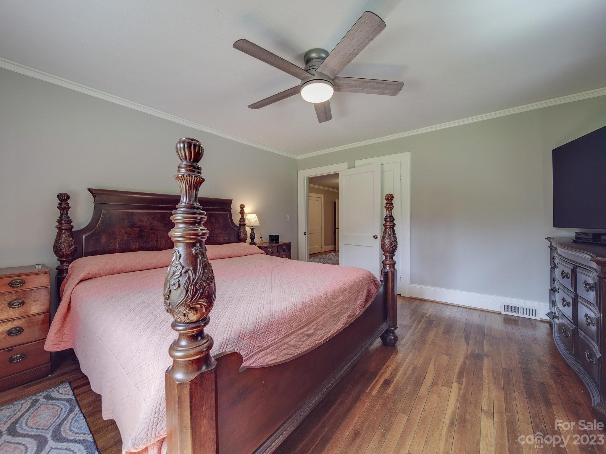 4901 Highway 24 Midland, NC 28107 - Photo 21 of 31 a bed room with a bed and a chandelier