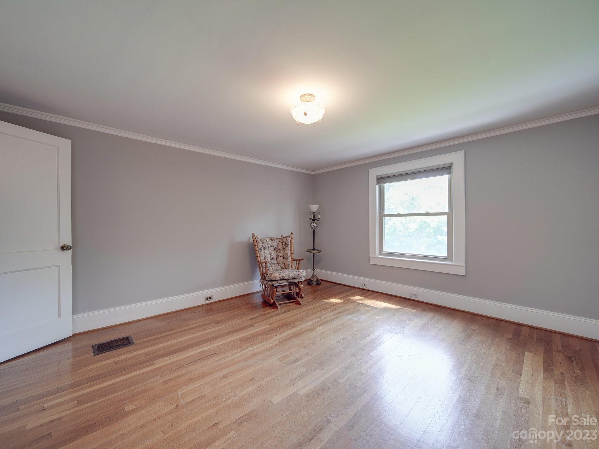 4901 Highway 24 Midland, NC 28107 - Photo 24 of 31 an empty room with wooden floor and windows