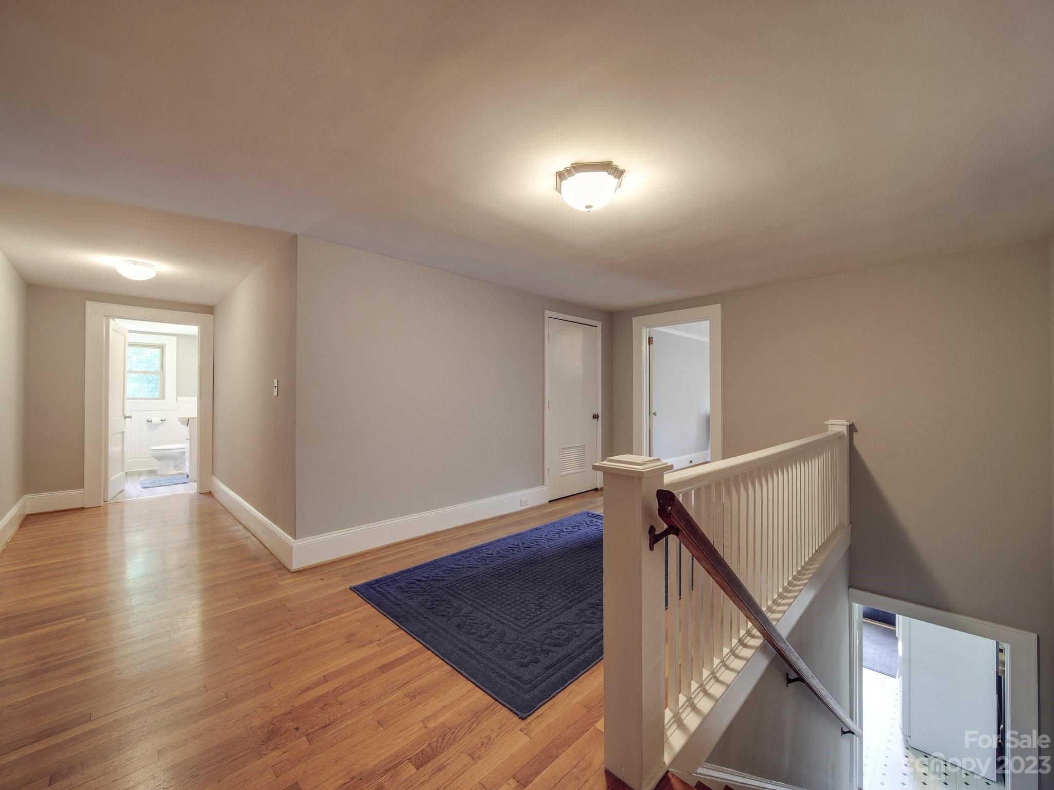 4901 Highway 24 Midland, NC 28107 - Photo 27 of 31 a view of an empty room with wooden floor and stairs
