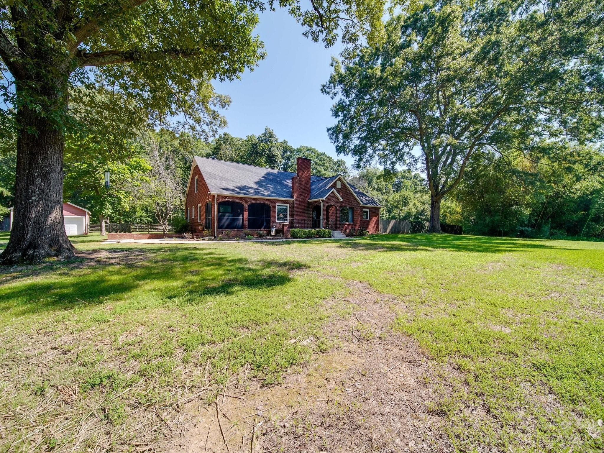 4901 Highway 24 Midland, NC 28107 - Photo 3 of 31 a view of a house with a big yard and large trees
