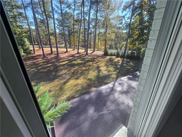 a living room with furniture a table and a window