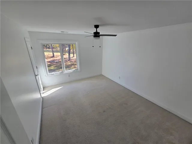 a view of a room with lots of wooden floors