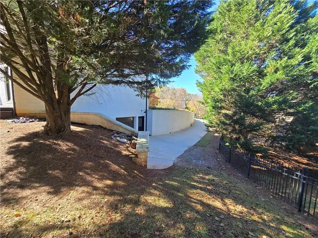 an empty room with wooden floor and entrance