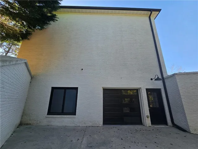 a kitchen with a refrigerator and a table