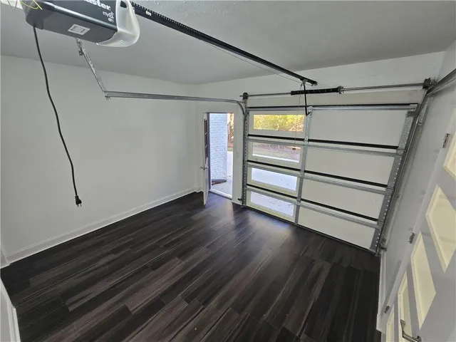 a view of an entryway with wooden floor