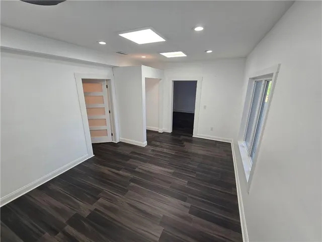 a view of entryway with wooden floor