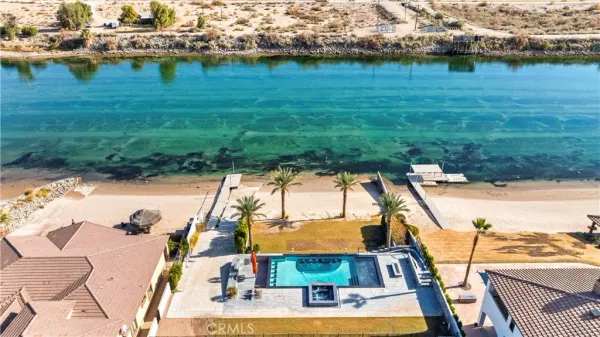 a view of swimming pool with a yard and seating area
