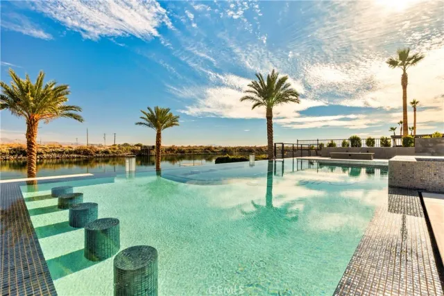 a view of a swimming pool with a patio
