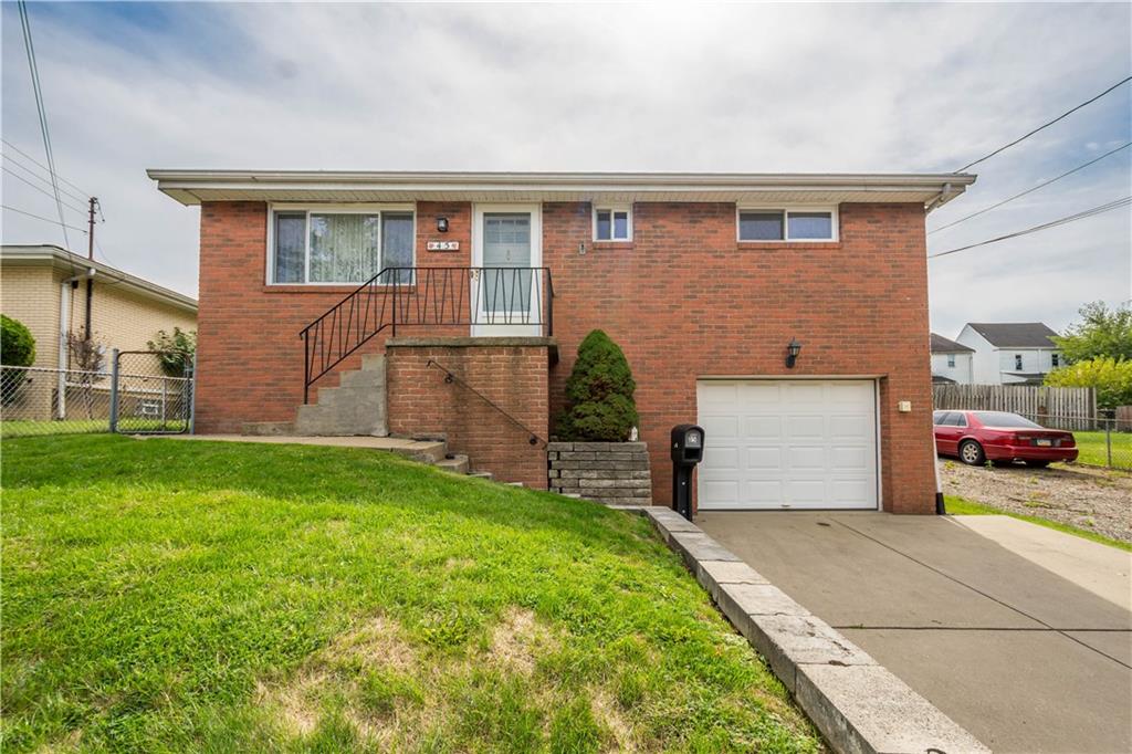 45 Harlem Avenue McKees Rocks, PA 15136 - Photo 1 of 31 a view of a house with a yard and garage
