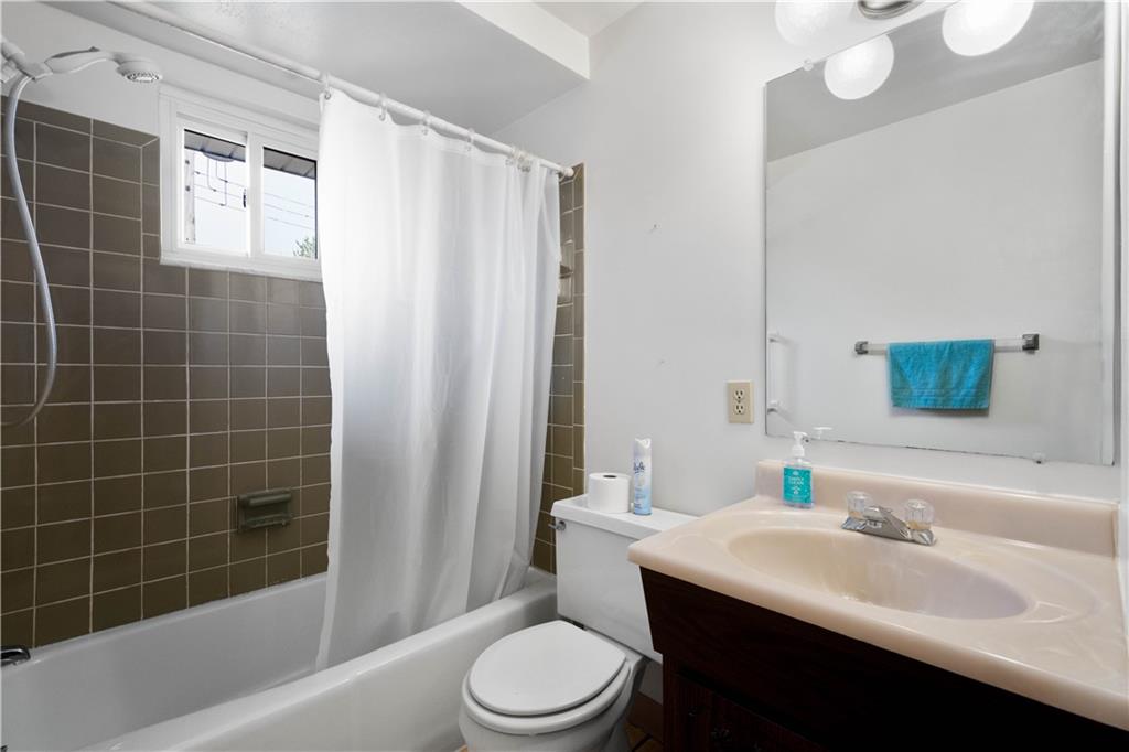 45 Harlem Avenue McKees Rocks, PA 15136 - Photo 18 of 31 a bathroom with a sink a toilet and shower
